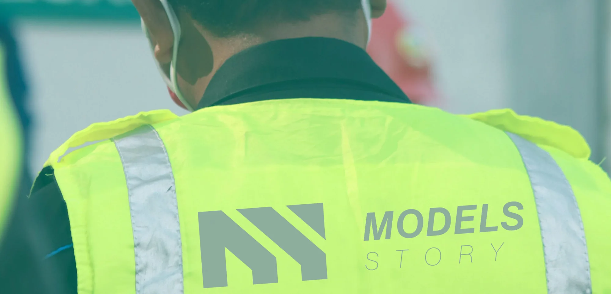 Models Story team member in a branded safety vest