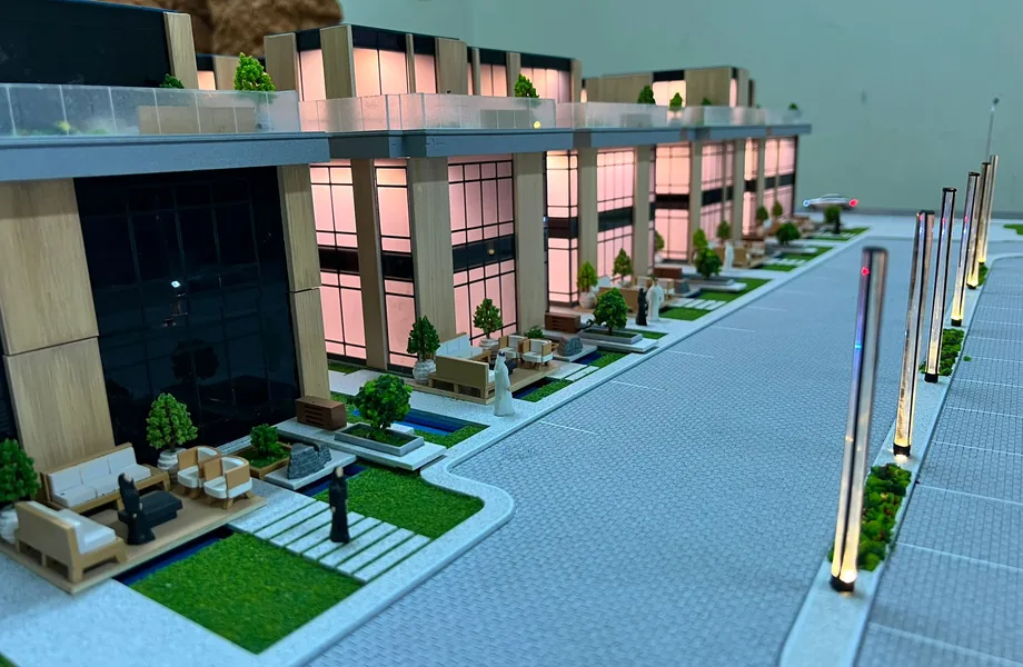 Street of lit townhouse models