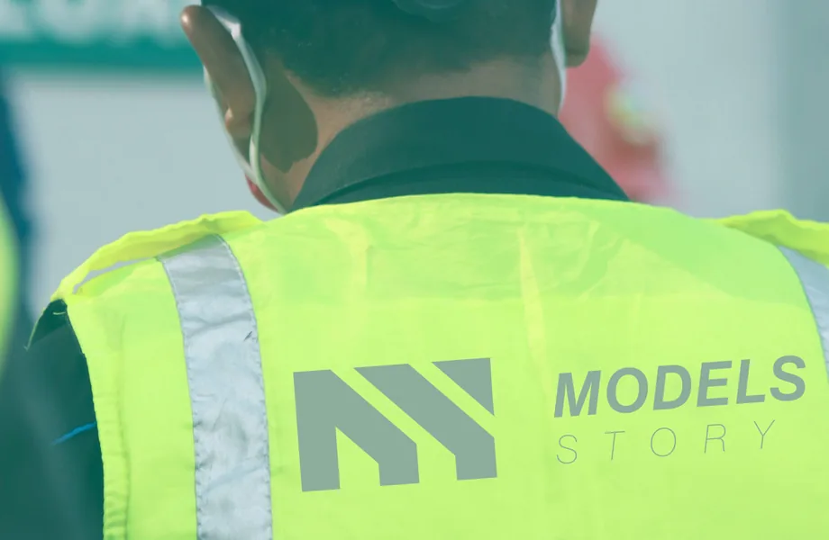 Models Story team member in a branded safety vest
