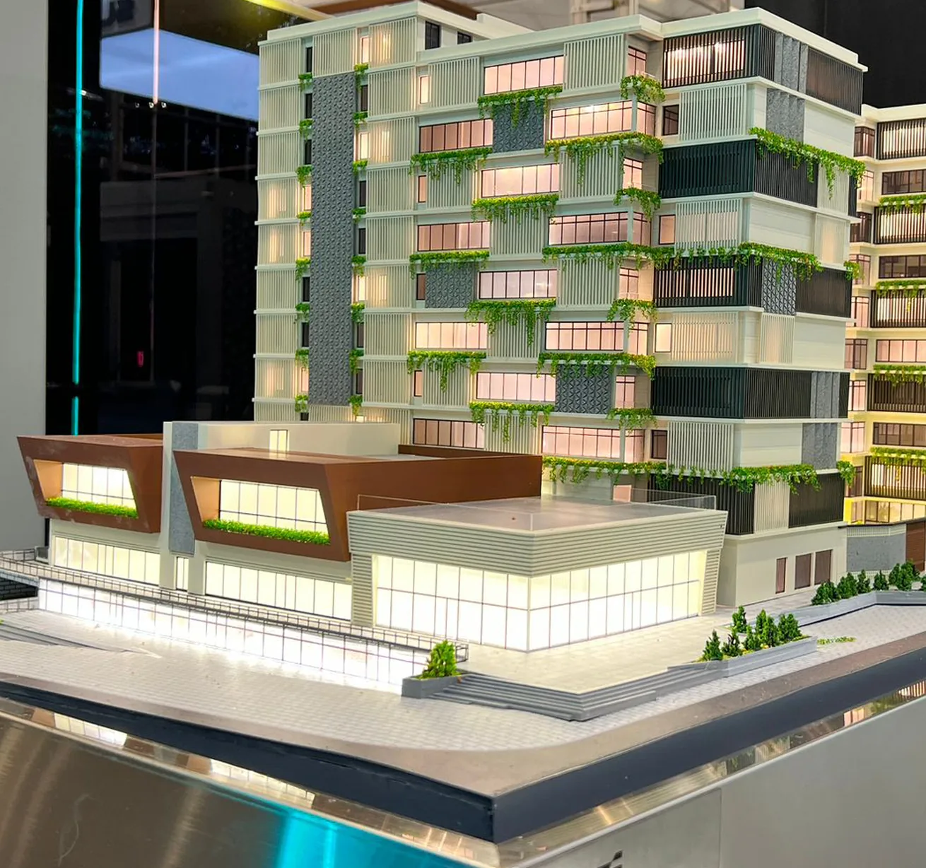 Scale model of a mixed-use building on a black base
